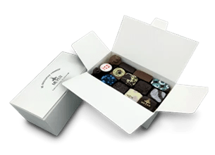 Ballotin de chocolats  (Chocolats Noir et Lait, Avec alcool, Avec praliné, Avec ganache, Avec pâte d'amandes, Avec gluten) - Photo 1
